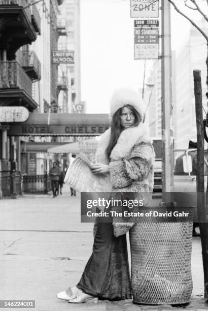 Blues singer Janis Joplin poses for a portrait on March 3, 1969 outside of the entrance to the Chelsea Hotel in New York City, New York.