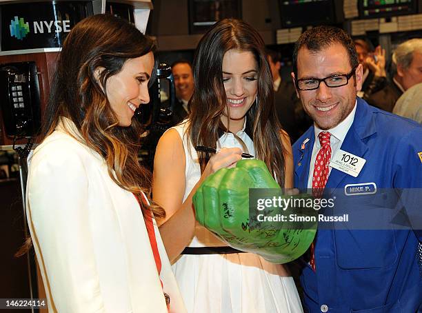 Jordana Brewster and Julie Gonzalo two cast members of the new series "Dallas" visit The New York Stock Exchange to ring the closing bell on June 12,...