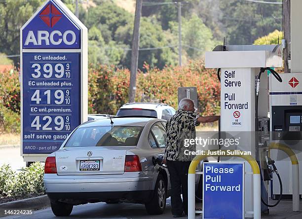 Customer pumps gasoline into his car on June 12, 2012 in Mill Valley, California. According to the Energy Department's weekly fuel survey, the...