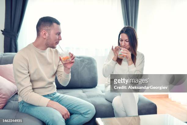 day date at home for male and female enjoying drinks - drunk wife at party stockfoto's en -beelden