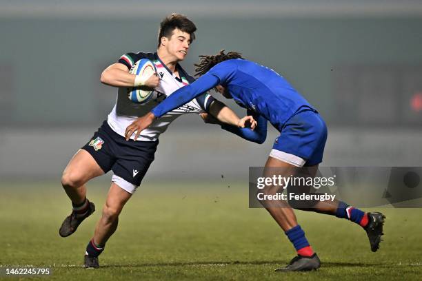 Alessandro Gesi of Italy is tackled by Theo Attissogbe of France during the U20 Six Nations Rugby match between Italy and France at Stadio comunale...