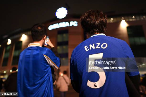 Fan of Chelsea is seen wearing a replica shirt of new signing Enzo Fernandez outside the stadium prior to the Premier League match between Chelsea FC...