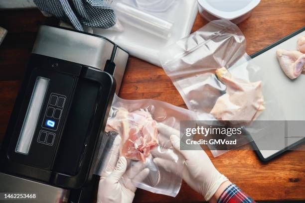 food safety - preserving fresh chicken in a plastic bag with a vacuume sealer - airtight stock pictures, royalty-free photos & images