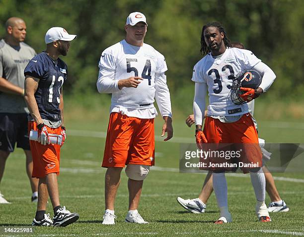 Johnny Knox, Brian Urlacher and Charles Tillman of the Chicago Bears chat during a minicamp practice at Halas Hall on June 12, 2012 in Lake Forest,...