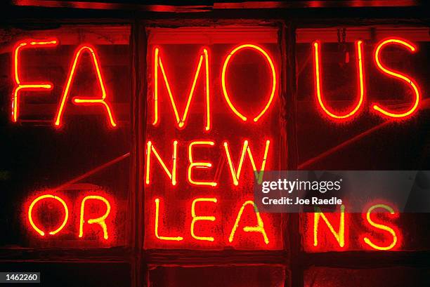 Street sign glows along Bourbon Street October 4, 2002 in the French Quarter of New Orleans, Louisiana. With Its exquisite Spanish architecture,...