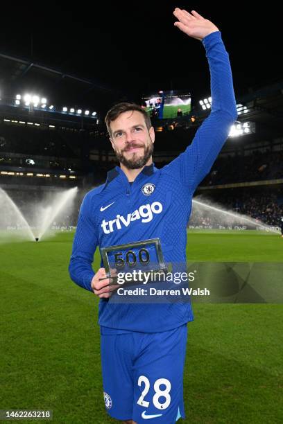 Cesar Azpilicueta of Chelsea poses for a photo with an award for their 500 Chelsea appearances during the Premier League match between Chelsea FC and...