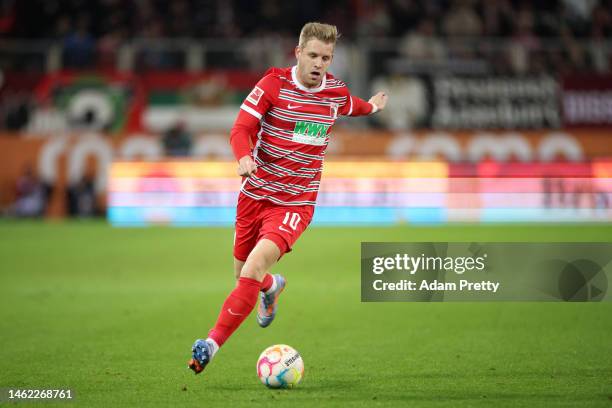 Arne Maier of FC Augsburg runs with the ball during the Bundesliga match between FC Augsburg and Bayer 04 Leverkusen at WWK-Arena on February 03,...