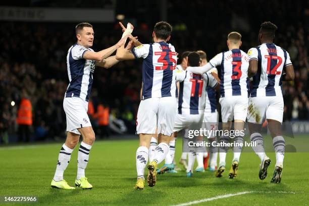 Jed Wallace and Okay Yokuslu of West Bromwich Albion celebrate after their teammate Grady Diangana scores the team's first goal during the Sky Bet...