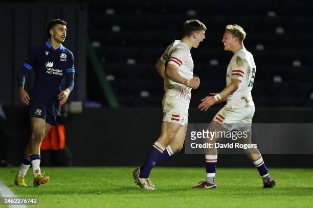 Tobias Elliott of England celebrates after scoring their side's sixth try with Sam Harris during the U20 Six Nations Rugby match between England and...