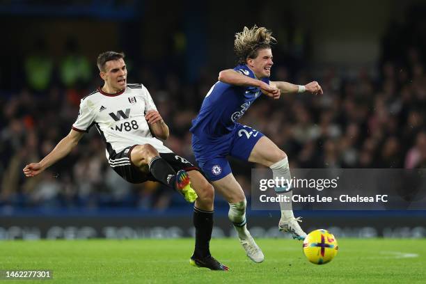 Conor Gallagher of Chelsea is challenged by Joao Palhinha of Fulham during the Premier League match between Chelsea FC and Fulham FC at Stamford...