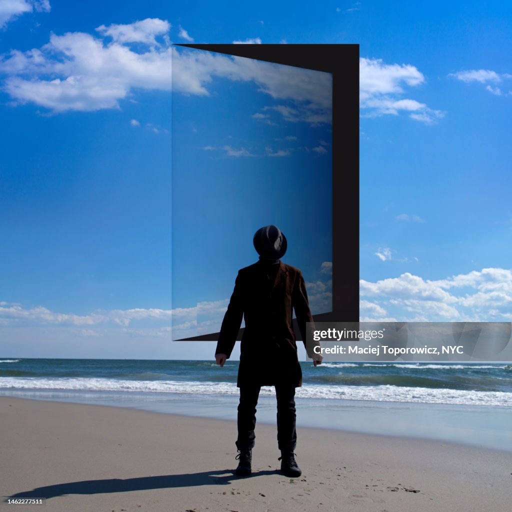 Man stands in front of the opened door in the sky.