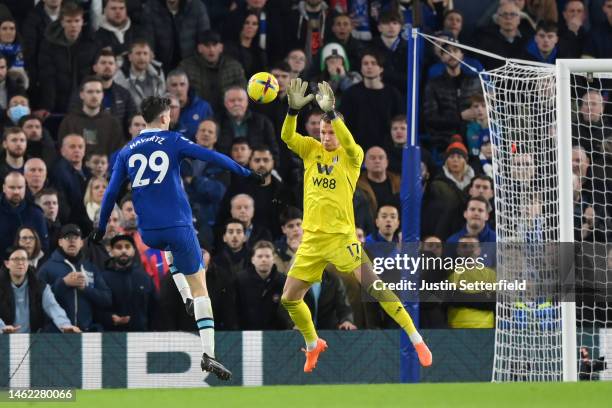 Kai Havertz of Chelsea shoots whilst under pressure from Bernd Leno of Fulham during the Premier League match between Chelsea FC and Fulham FC at...