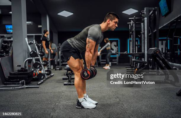 young man training in the gym - deadlift stock pictures, royalty-free photos & images