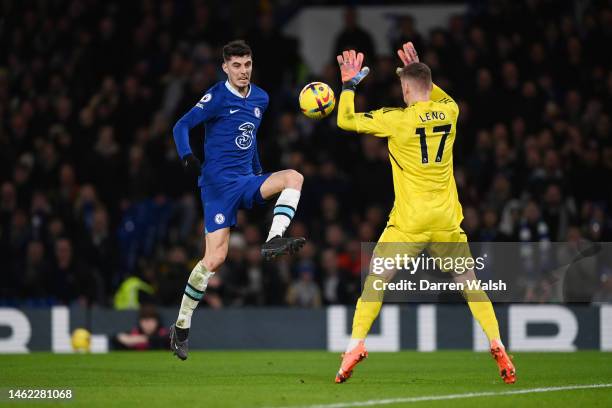 Kai Havertz of Chelsea shoots whilst under pressure from Bernd Leno of Fulham during the Premier League match between Chelsea FC and Fulham FC at...