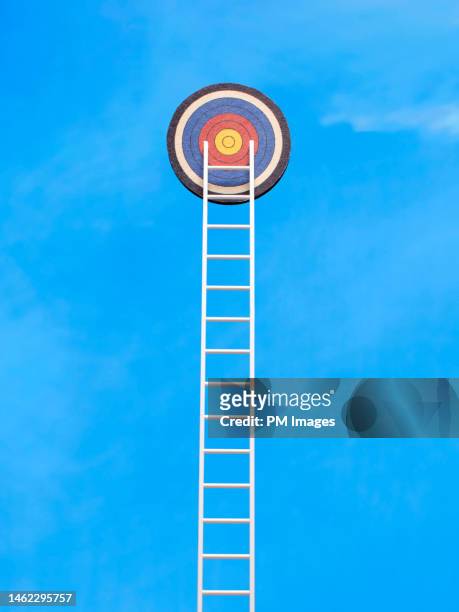 climbing to the goal - ladder and target - strategic initiative stock pictures, royalty-free photos & images
