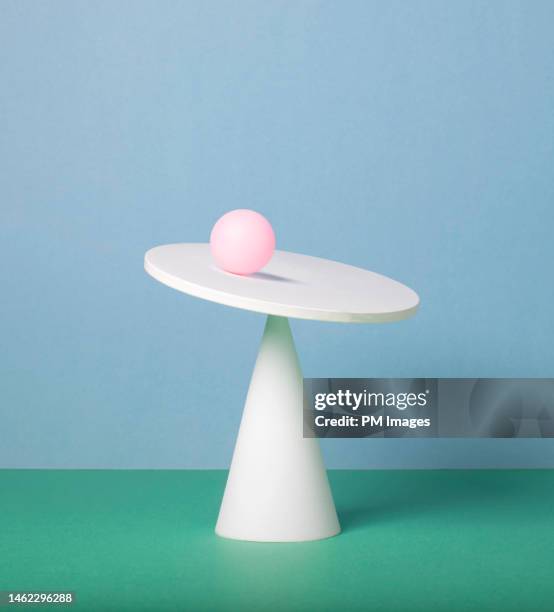 pink ball balancing - schief stock-fotos und bilder