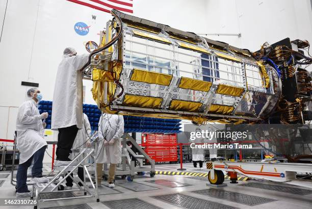 Clean room engineers and technicians prepare the scientific core of the NASA-ISRO Synthetic Aperture Radar satellite inside a Spacecraft Assembly...