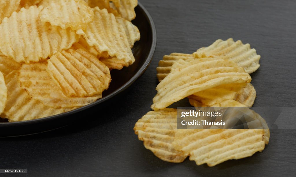 Close-up of crispy fried waffle potato chips