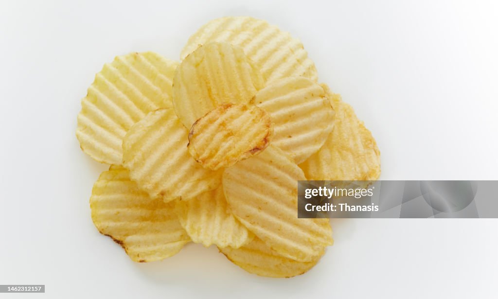 Close-up of crispy fried waffle potato chips