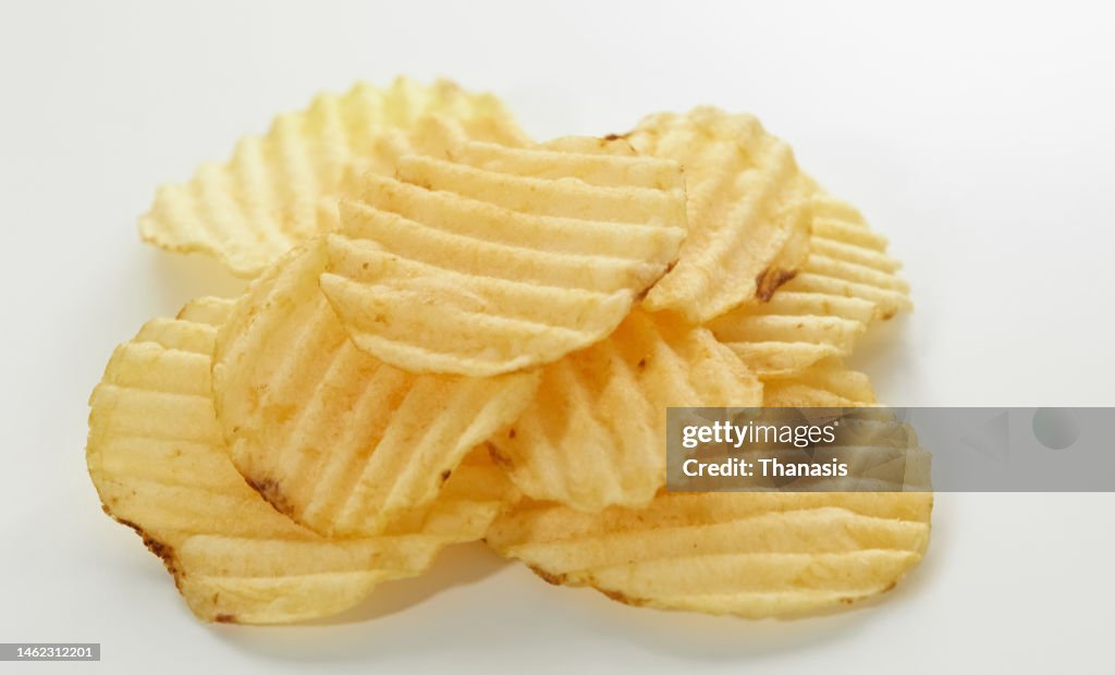 Close-up of crispy fried waffle potato chips