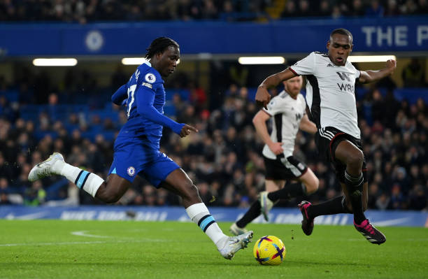 Datro Fofana of Chelsea shoots under pressure from Issa Diop of Fulham during the Premier League match between Chelsea FC and Fulham FC at Stamford...