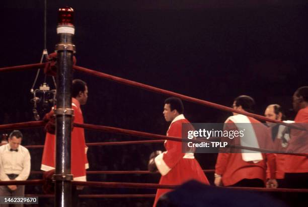 Referee Arthur Mercante Sr. Stands in the ring as assistant trainer Drew Bundini Brown , American heavyweight boxing champion Muhammad Ali , trainer...