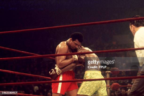 American heavyweight boxing champion Muhammad Ali and current champion Joe Frazier square off during their 'Fight of the Century' bout at Madison...