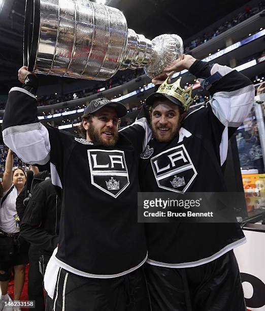 Mike Richards and Anze Kopitar of the Los Angeles Kings hold up the Stanley Cup after the Kings defeated the New Jersey Devils 6-1 to win the Stanley...