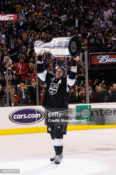 Anze Kopitar of the Los Angeles Kings holds up the Stanley Cup after the Kings defeated the New Jersey Devils 6-1 to win the Stanley Cup series 4-2...