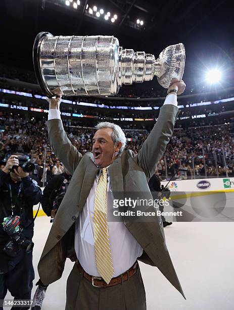 Head Coach Darryl Sutter of the Los Angeles Kings holds up the Stanley Cup after the Kings defeated the New Jersey Devils 6-1 to win the Stanley Cup...