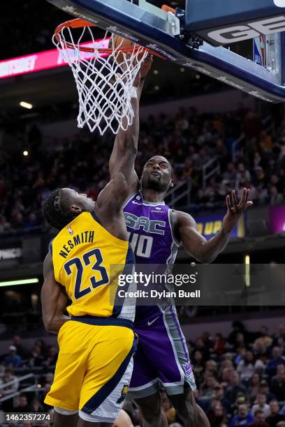 Harrison Barnes of the Sacramento Kings dunks the ball over Aaron Nesmith of the Indiana Pacers in the second quarter of the game at Gainbridge...