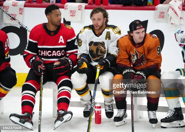 Seth Jones of the Chicago Blackhawks, David Pastrnak of the Boston Bruins and Clayton Keller of the Arizona Coyotes look on during the Discover NHL...