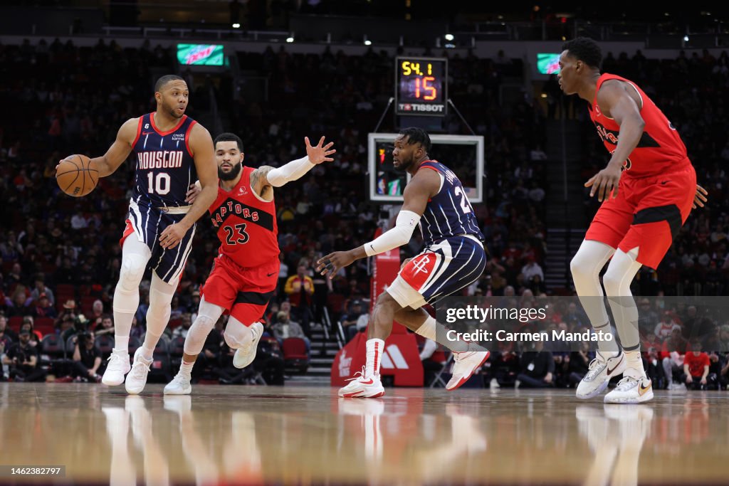 Houston Rockets Toronto Raptors Eric Gordon of the Houston Rockets controls the ball ahead of Fred ...