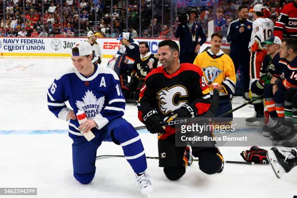 Mitchell Marner of the Toronto Maple Leafs jokes with Nazem Kadri of the Calgary Flames during the 2023 NHL All-Star Skills Competition at FLA Live...