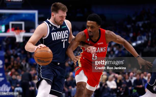 Luka Doncic of the Dallas Mavericks handles the ball as Herbert Jones of the New Orleans Pelicans defends in the first half at American Airlines...