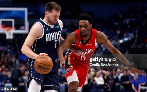 Luka Doncic of the Dallas Mavericks handles the ball as Herbert Jones of the New Orleans Pelicans defends in the first half at American Airlines...