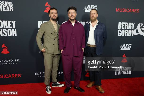 Ben Lovett, Marcus Mumford, and Ted Dwane of Mumford & Sons attend MusiCares Persons of the Year Honoring Berry Gordy and Smokey Robinson at Los...