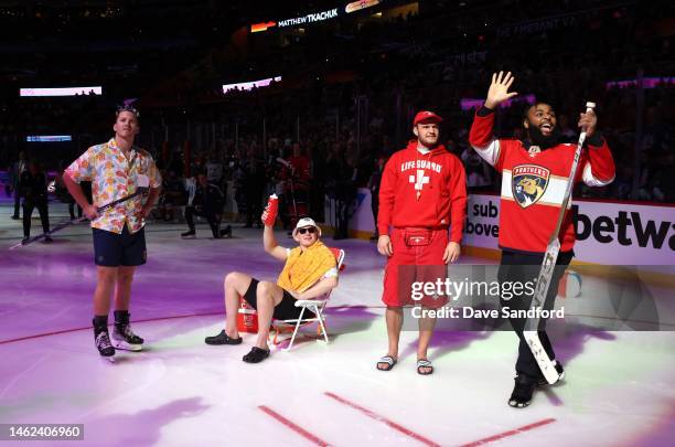 Matthew Tkachuk of the Florida Panthers, Brady Tkachuk of the Ottawa Senators, Aleksander Barkov of the Florida Panthers and Christian Wilkins of the...