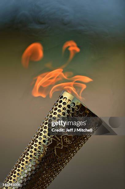 View of the Olympic Torch during the London 2012 Olympic Torch Relay on June 13, 2012 in St Andrews, Scotland. The Olympic Flame is now on day 26 of...