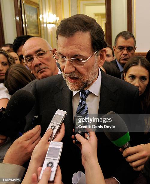 Spanish Prime Minister Mariano Rajoy speaks to the media during a parliamentary Q&A session on June 13, 2012 in Madrid, Spain. Spain has requested...