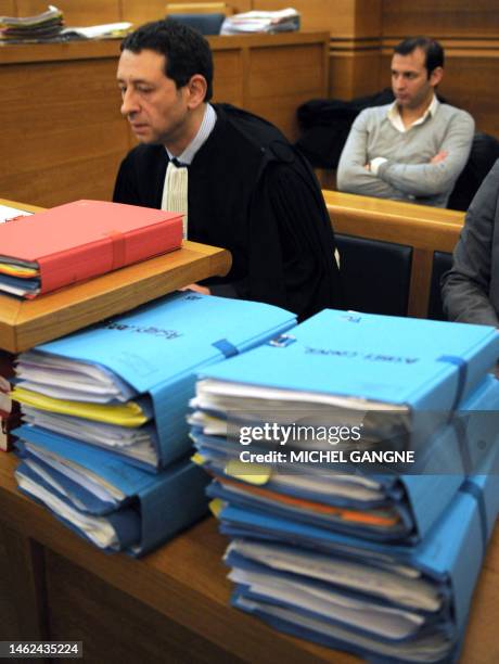 French Philippe Soussi , lawyer of Anthony Ashley-Cooper's family, 10th Earl of Shaftesbury, is pictured behind the files on February 4, 2009 at...