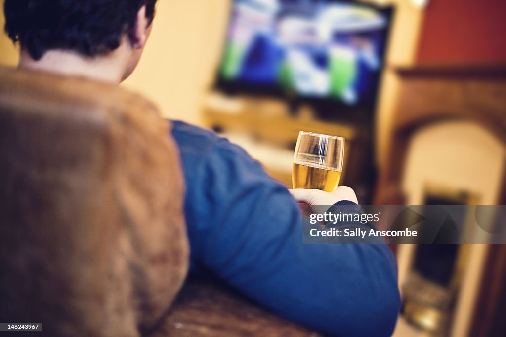 Man watching football on television