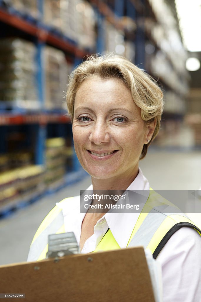 Female manager in a food distribution warehouse