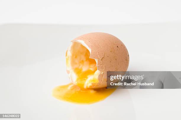 soft boiled egg spilling out over plate - soft boiled egg stock pictures, royalty-free photos & images