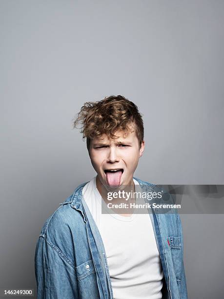 portrait of young man - man tongue stock pictures, royalty-free photos & images