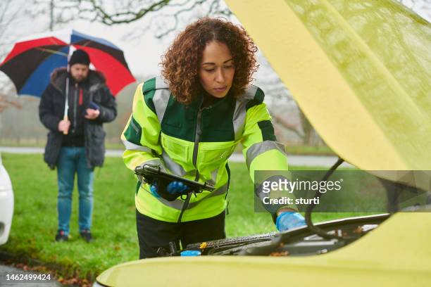 female mechanic roadside assistance portrait - aa stock pictures, royalty-free photos & images
