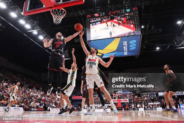 Tim Coenraad of the Hawks wins a rebound over Fabijan Krslovic of the Jackjumpers during the round 18 NBL match between Illawarra Hawks and Tasmania...