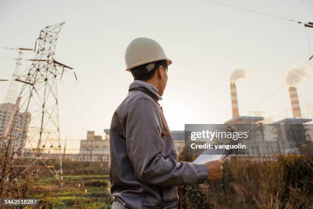 young engineers working in power plants work with confidence - china factory stock pictures, royalty-free photos & images