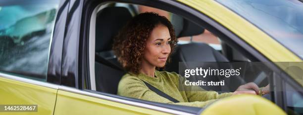 female driver - right hand drive stock pictures, royalty-free photos & images