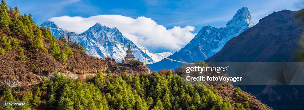 Everest Lhotse Ama Dablam overlooking Bhuddist Stupa prayer flags Himalayas